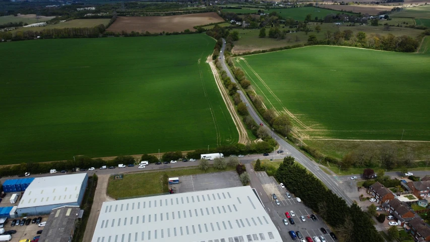 an aerial view of a large green field, highfleet, production ig studios, taken from the high street, high polygon