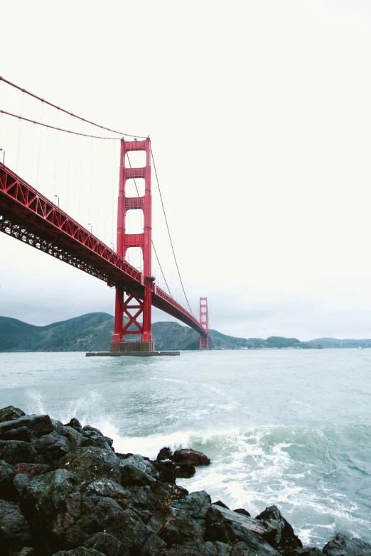 a red bridge over a body of water, unsplash, hyperrealism, sf, 2 5 6 x 2 5 6 pixels, giants, multiple stories