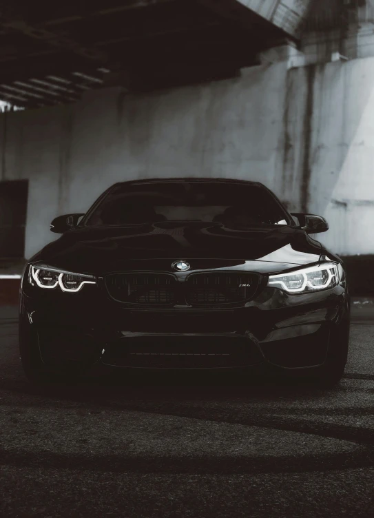 a bmw car parked in a parking garage, pexels contest winner, black on black, instagram post 4k, headlights, sportcar