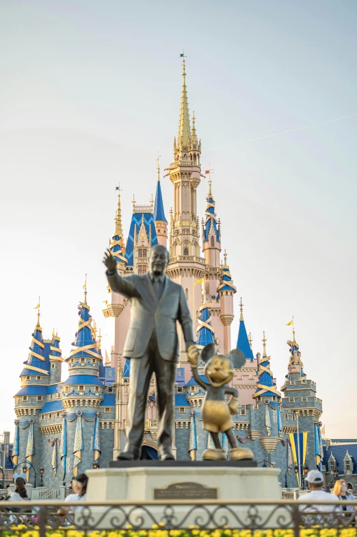 a statue of walt and mickey mouse in front of a castle, visual art, majestic spires, photograph, ad image, f / 1