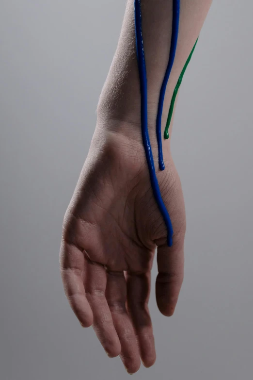 a person holding a toothbrush in their hand, a digital rendering, by David Simpson, thin blue arteries, hans bellmer and nadav kander, rgb wires, marfan syndrome