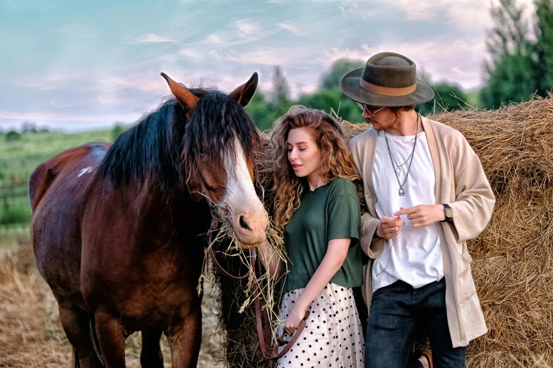 a man and a woman standing next to a horse, by Adam Marczyński, pexels contest winner, wearing a straw hat and overalls, ad image, romantic scene, teenage girl