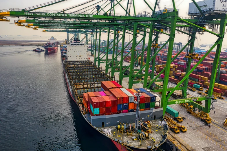 a large cargo ship in a large body of water, pexels contest winner, happening, docked at harbor, avatar image, singapore, full frame image