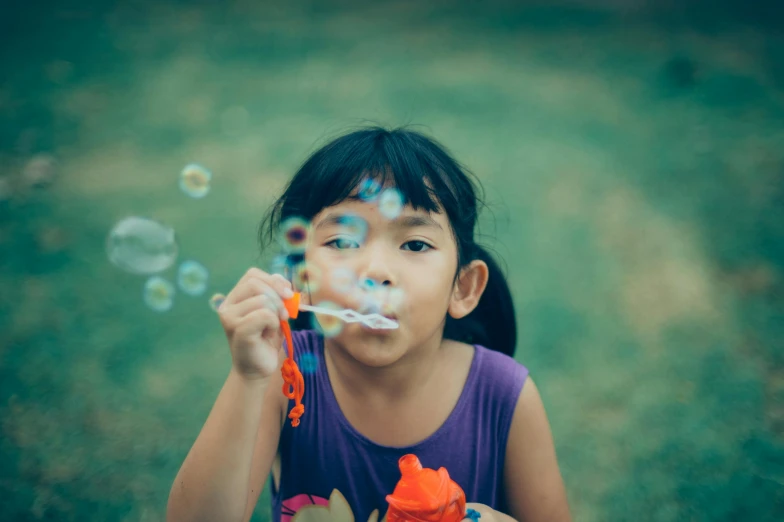 a little girl blowing bubbles on top of a lush green field, pexels contest winner, asian female, avatar image, square, pigtails hairstyle