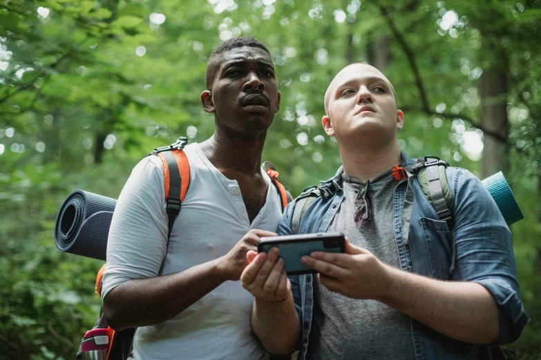 a couple of men standing next to each other in the woods, pexels, renaissance, he is holding a smartphone, avatar image, lgbtq, trecking