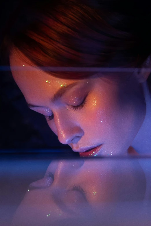 a close up of a person looking at a cell phone, by Adam Marczyński, holography, portrait of a woman underwater, stars reflecting on the water, smooth glowing skin, lying down