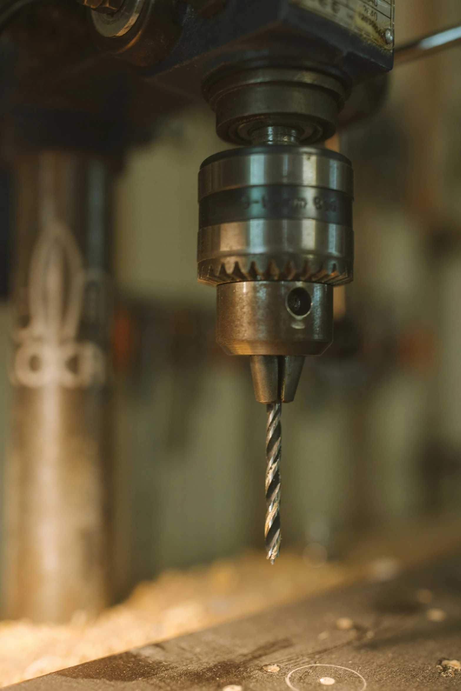 a close up of a drill on a machine, by Johannes Martini, stainless steel, carson ellis, middle shot, carefully crafted