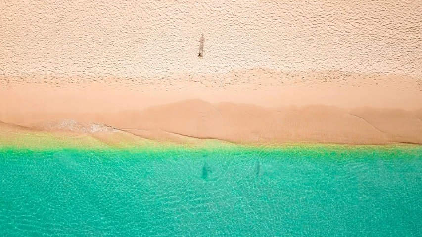 a large body of water next to a sandy beach, unsplash contest winner, minimalism, pink and teal and orange, airborne view, the emerald coast, tan complexion