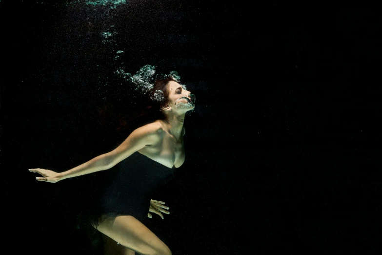 a woman in a black swimsuit under water, a portrait, by Emma Andijewska, pexels contest winner, conceptual art, 15081959 21121991 01012000 4k, backlit, rectangle, excitement