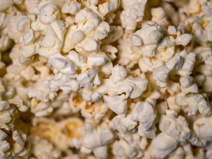 a pile of popcorn sitting on top of a table, trending on pexels, background image, fan favorite, close-ups, 2000s photo