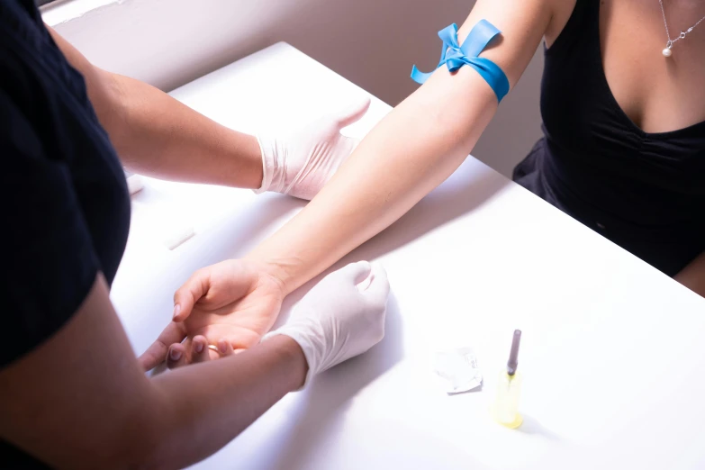 a woman getting a tattoo on another woman's arm, blood collection vials, blue veins, lachlan bailey, profile image