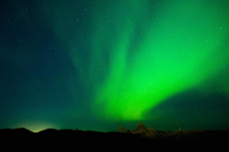 the aurora bore lights up the night sky, an album cover, pexels contest winner, hurufiyya, bright green dark orange, reykjavik, black blue green, light green