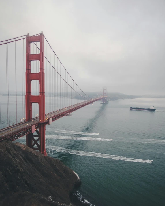 a large bridge over a body of water, by Ryan Pancoast, pexels contest winner, transgender, sf, boat, very accurate photo