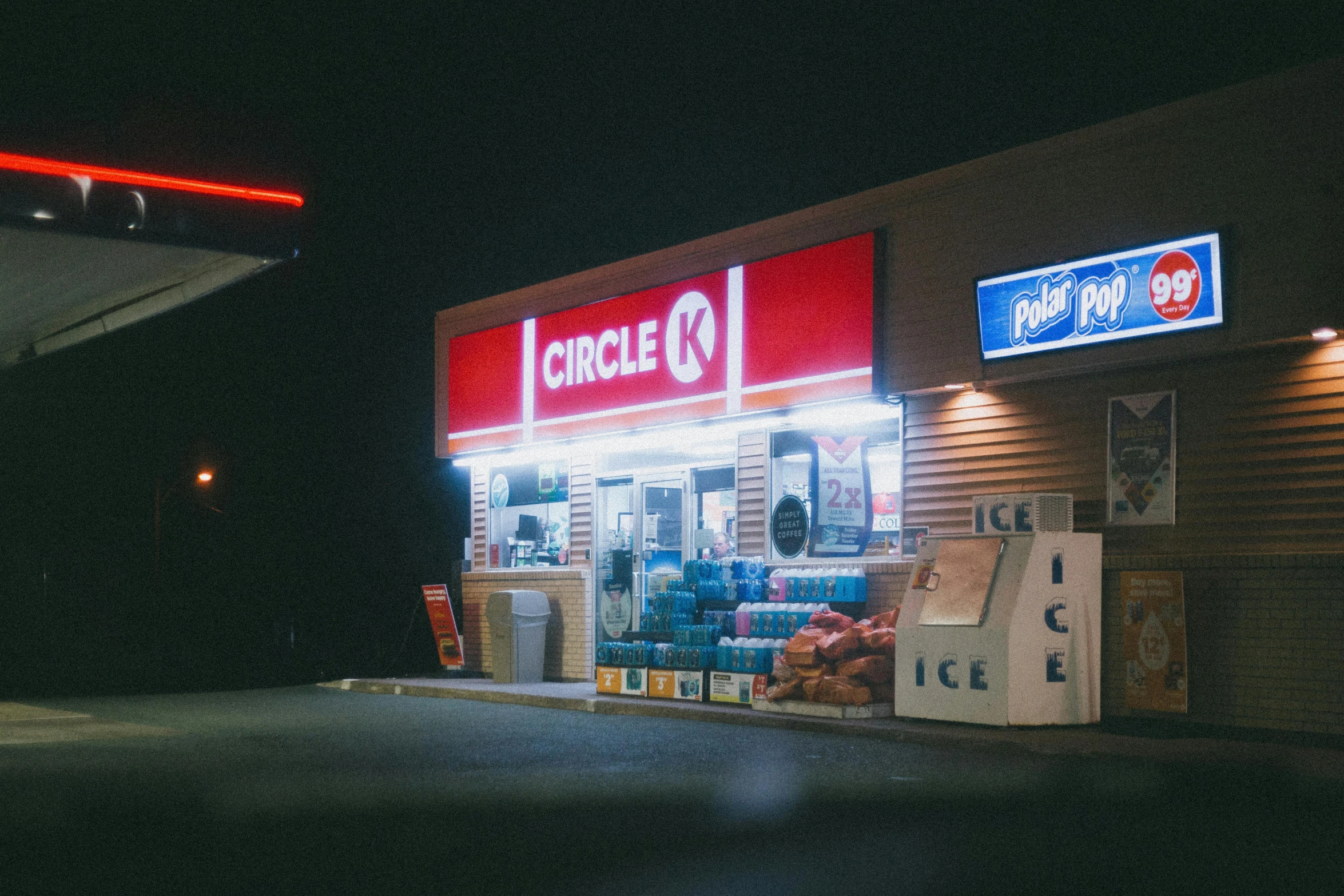 a convenience store is lit up at night, a polaroid photo, pexels contest winner, photorealism, circle pit, circlet, krystal, magazine photo