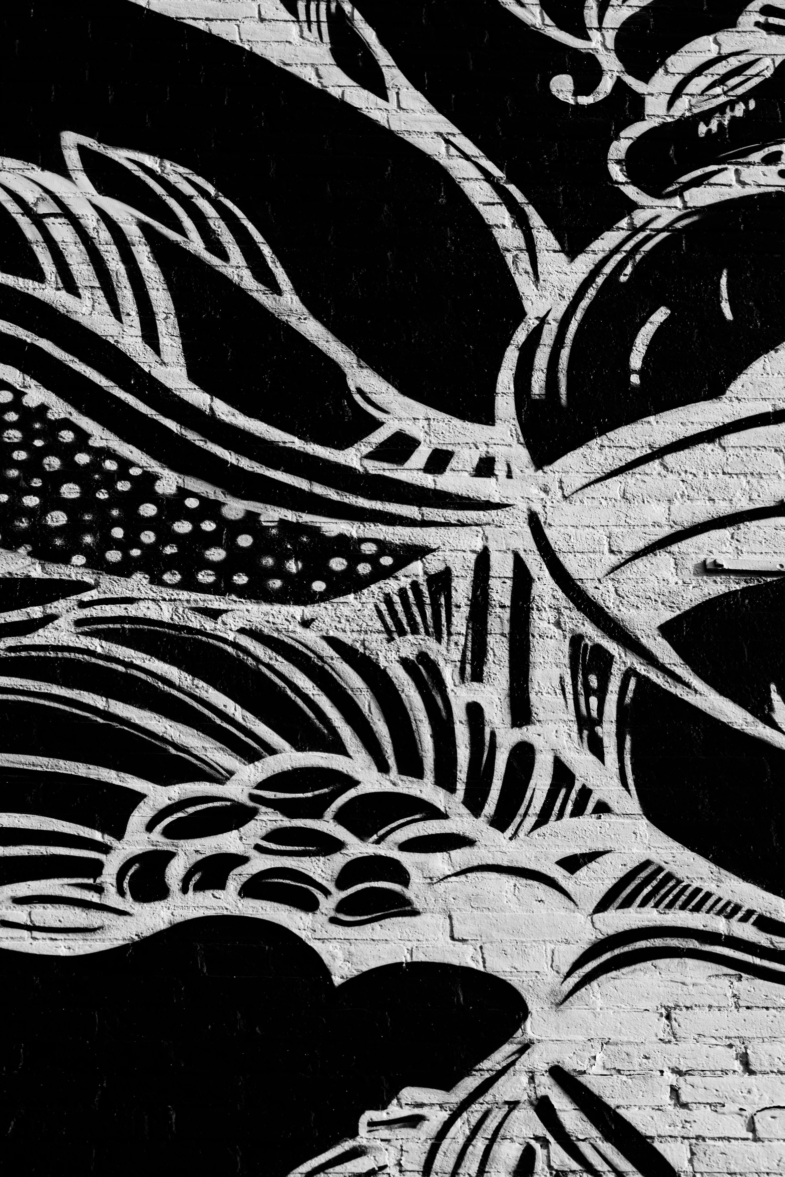 a black and white drawing of flowers on a brick wall, an abstract drawing, unsplash, tribal paint, digital art - n 5, detail, evening time
