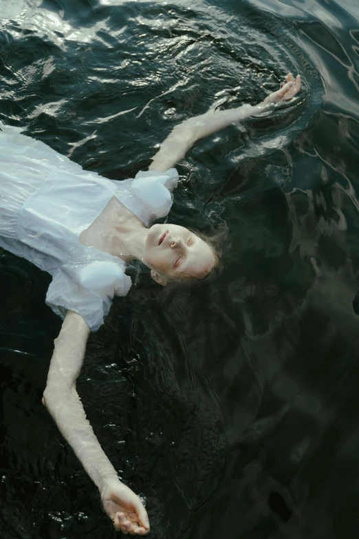 a woman in a white dress floating in a body of water, pexels contest winner, renaissance, sadie sink, dark, felix englund, unconscious