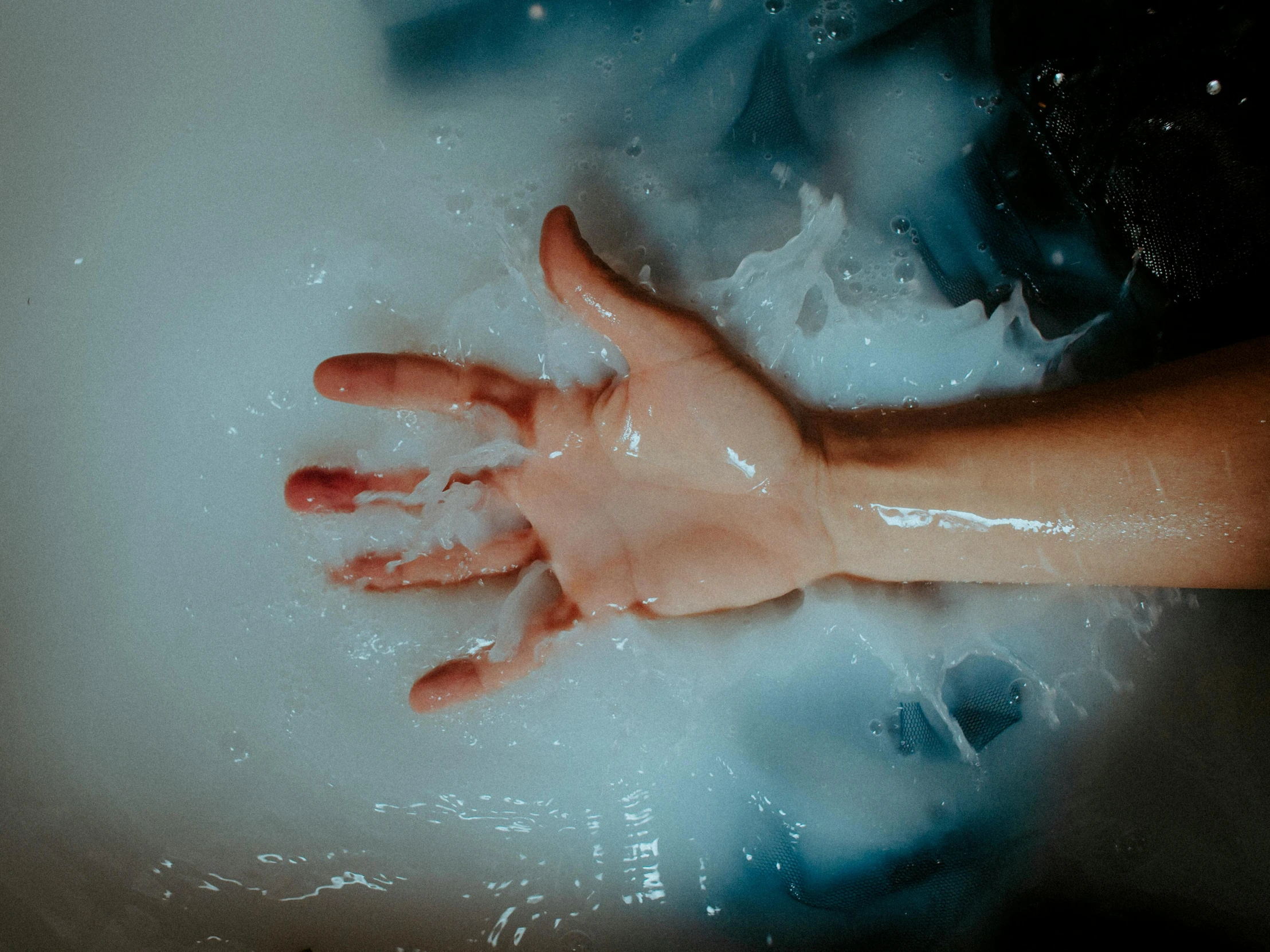 a close up of a person's hand in a bathtub, inspired by Elsa Bleda, pexels, process art, realistic jelly splashes, ectoplasm, ilustration, shrugging arms
