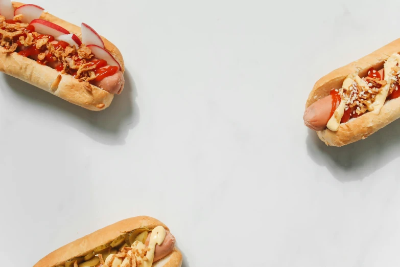 a group of hot dogs sitting on top of a table, trending on pexels, hyperrealism, background image, profile image, 3 - piece, bao phan