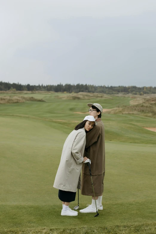 a couple of people standing on top of a green field, straw hat and overcoat, golf course, sangsoo jeong, lovers