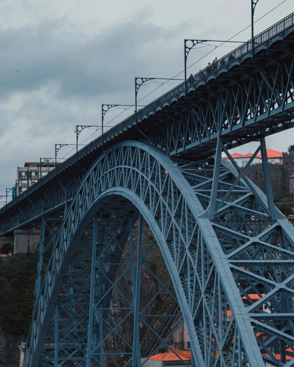 a train crossing a bridge over a river, by Matija Jama, pexels contest winner, blue gray, huge support buttresses, gui guimaraes, gif