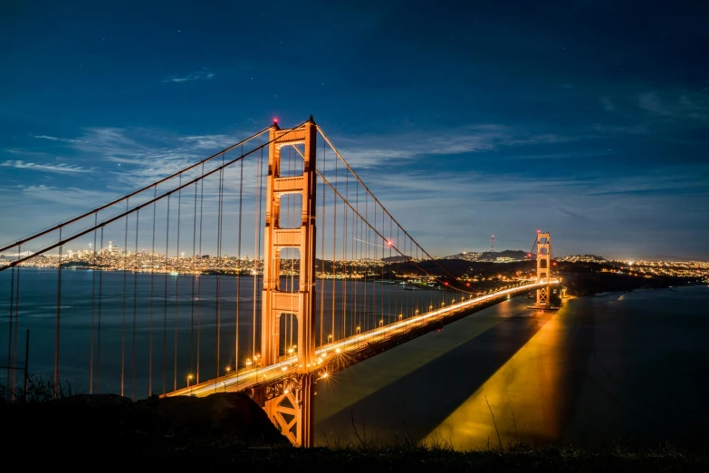 the golden gate bridge is lit up at night, pexels contest winner, renaissance, thumbnail, multiple stories, full frame image