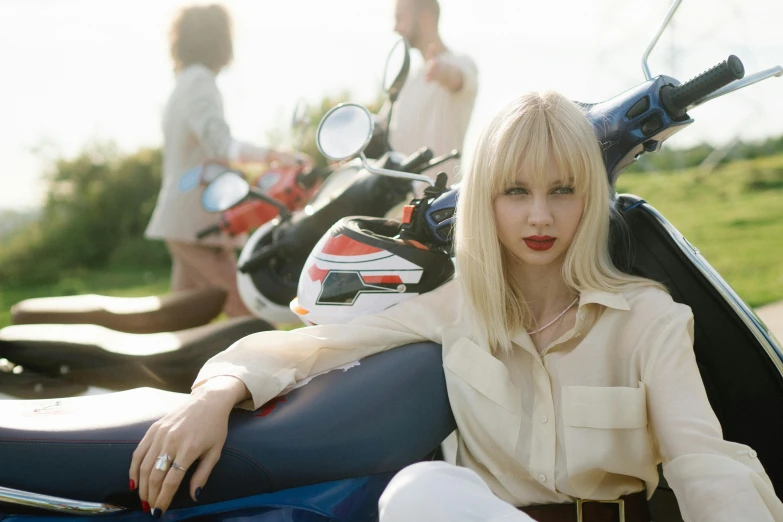 a woman sitting on the back of a motorcycle, an album cover, inspired by Andrew Boog Faithfull, trending on pexels, photorealism, very very pale blond hair, lalisa manobal, perfect android girl family, lipstick