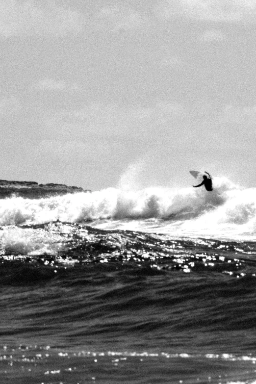 a man riding a wave on top of a surfboard, a black and white photo, flickr, low quality photograph, in flight, coast, clean thick line