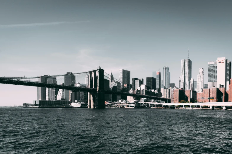 a black and white photo of the brooklyn bridge, pexels contest winner, modernism, view from the sea, industrial gotham city, color photo, 2000s photo