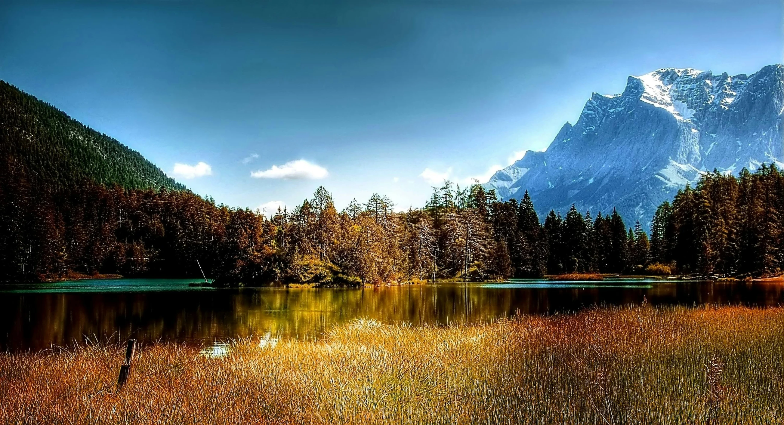 a lake with a mountain in the background, a picture, pexels contest winner, romanticism, autum, meadow, glossy surface, chamonix