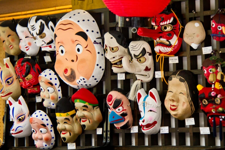 a bunch of masks hanging on a wall, by Yasushi Sugiyama, flickr, square, old japanese street market, fan favorite, japan animation