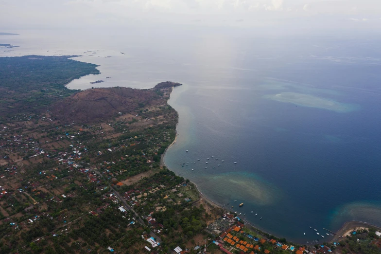 an aerial view of a large body of water, sumatraism, the sea seen behind the city, background image, thumbnail