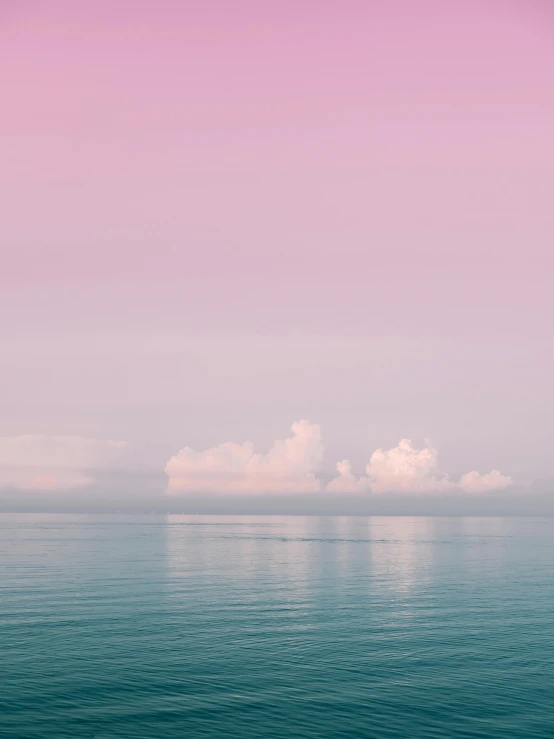 a large body of water with clouds in the sky, a minimalist painting, inspired by Elsa Bleda, trending on unsplash, romanticism, pink mist, seaview, colored photography, calmly conversing 8k