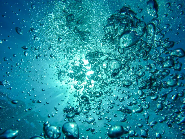 a bunch of bubbles floating in the water, a stipple, pexels, bubbly underwater scenery, wall of water either side, cerulean, shot on a 2 0 0 3 camera