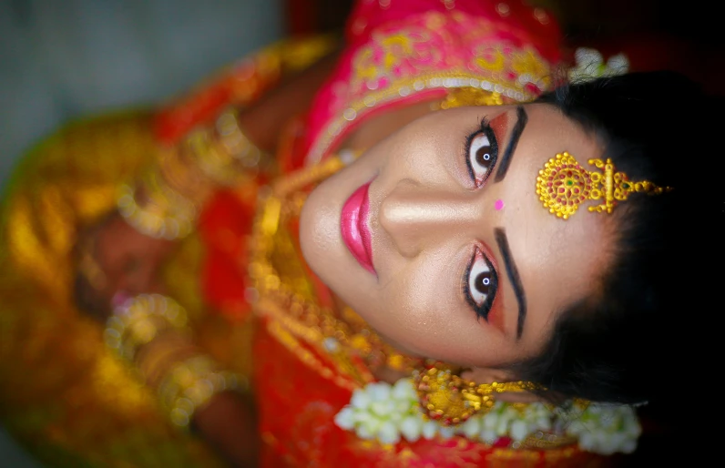 a close up of a woman wearing a red and gold outfit, by Sudip Roy, pexels contest winner, square, close up at face, bride, thumbnail