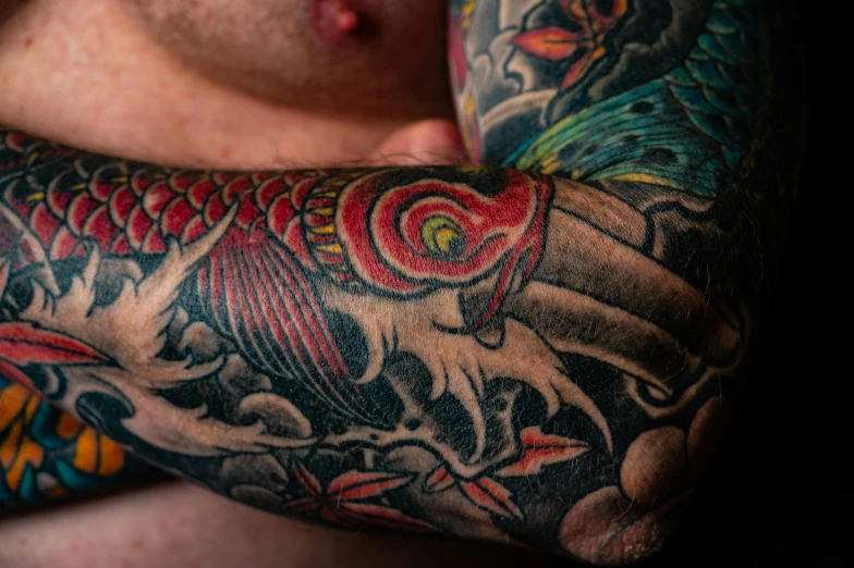 a man with a tattoo on his arm, pexels contest winner, koi, fan favorite, highly detailed and colored, closeup of arms