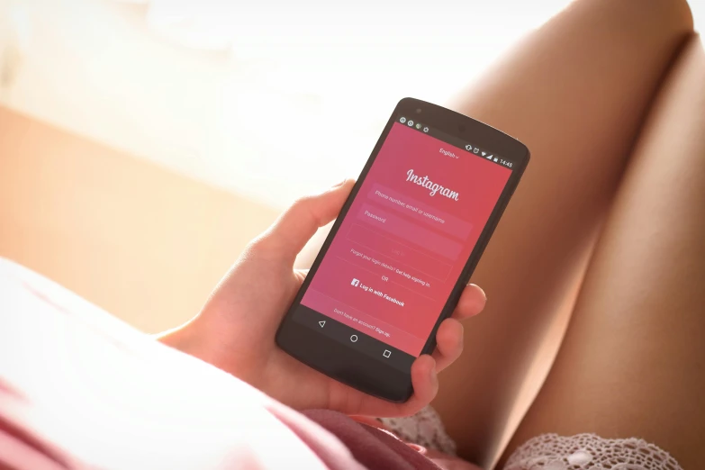 a close up of a person holding a cell phone, trending on instagram, happening, sitting on the bed, crimson gradient, girls, app design