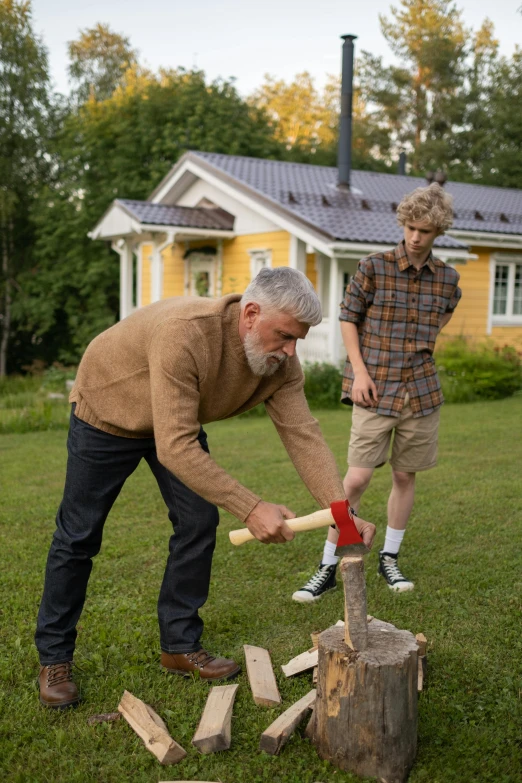 two men chopping wood in front of a yellow house, pexels contest winner, father time, cute boys, an oldman, midsommar - t