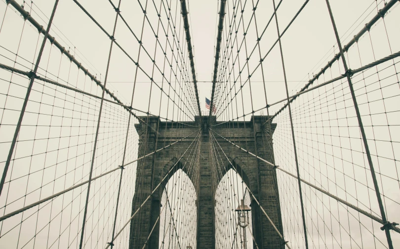 a black and white photo of the brooklyn bridge, inspired by Christo, pexels contest winner, vintage color photo, webs, 🚿🗝📝, symmetrical detail