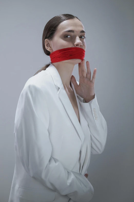 a woman with a red tape around her mouth, inspired by Marina Abramović, unsplash, wearing a labcoat, nadav kander, lgbtq, ilustration