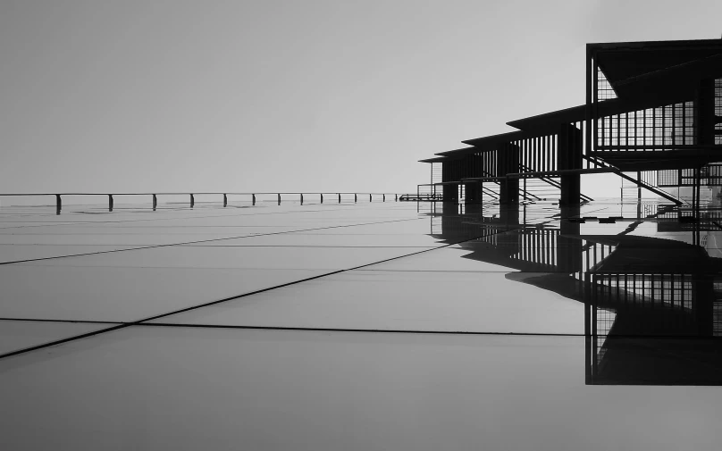 a black and white photo of a building, by Jan Rustem, unsplash, postminimalism, raytraced reflections, wired landscape, observation deck, horizon