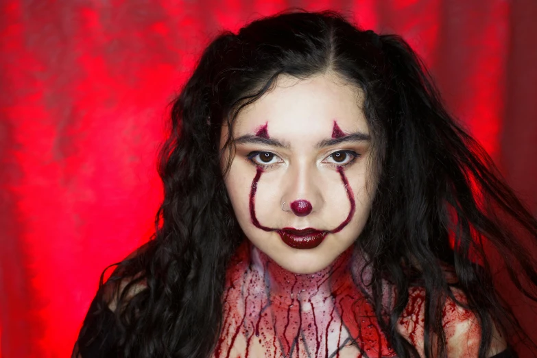 a woman with blood all over her face, an album cover, pexels contest winner, lowbrow, pennywise theme, charli xcx, youtube thumbnail, cosplay photo