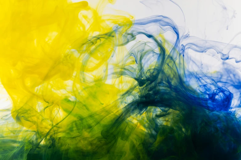 a close up of a yellow and blue substance, inspired by Morris Louis Bernstein, pexels, whirling green smoke, underwater ink, colors: yellow, neuroscience