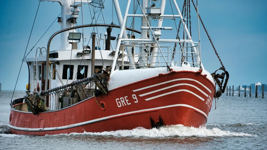 a large red boat traveling across a body of water, by Jan Gregoor, fishing, commercial photo, profile picture 1024px, gracked