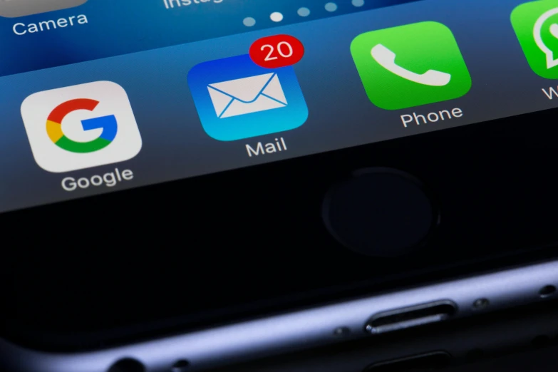 a cell phone sitting on top of a table, pexels, email, ios app icon, close up to the screen, monitor