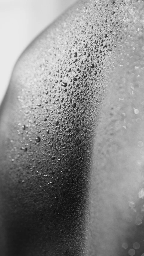 a black and white photo of a woman's back, a stipple, big drops of sweat, studio medium format photograph, sunbathed skin, water droplets on lens