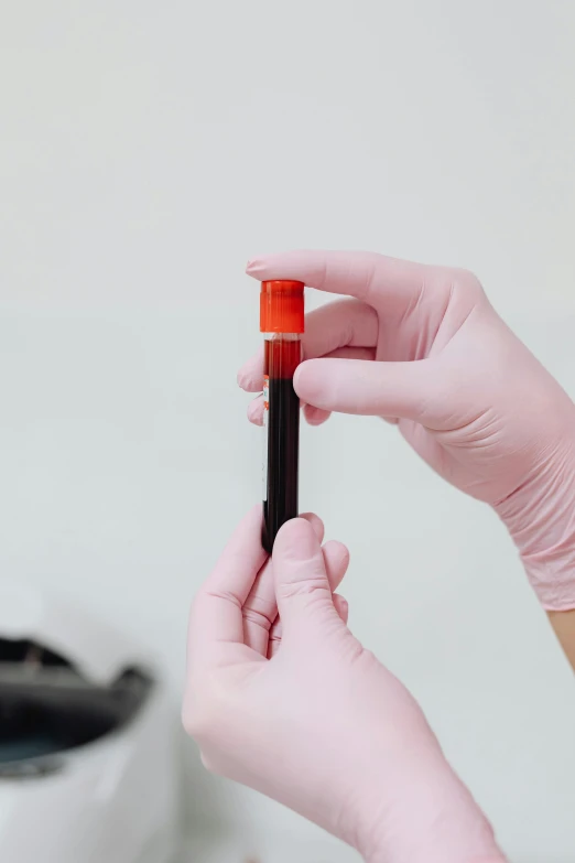 a close up of a person holding a tube of blood, gradient red to black, diagnostics, colour corrected, thumbnail