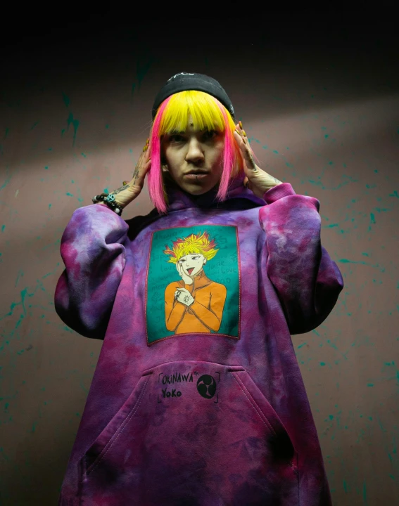 a woman with pink hair wearing a purple hoodie, inspired by Tadanori Yokoo, graffiti, 000 — википедия, wearing a tie-dye shirt, yellow hair, with index finger