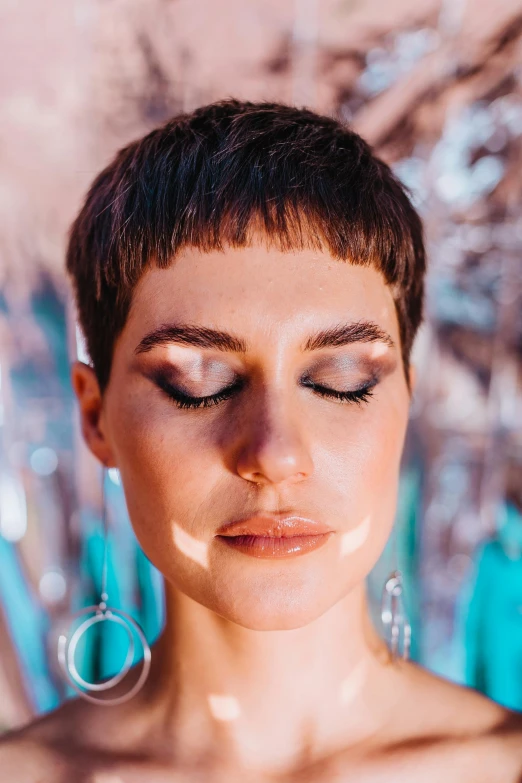 a close up of a woman with her eyes closed, by Julia Pishtar, pixie cut, channeling third eye energy, high quality photo, trending photo
