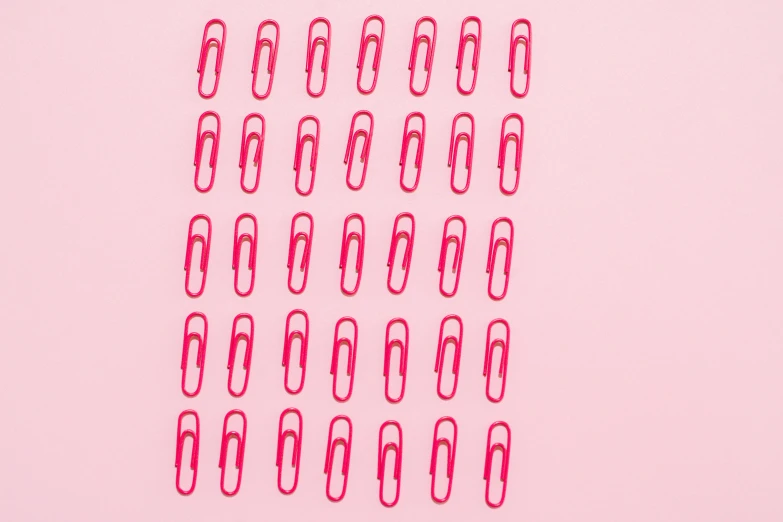 a group of red paper clips sitting on top of a white surface, pexels, pop art, ((pink)), 3 2 x 3 2, planner stickers, ffffound