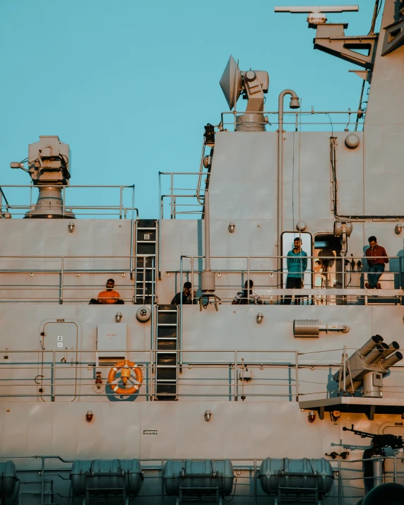 a large ship sitting on top of a body of water, lgbtq, automated defence platform, portrait photo, trending photo